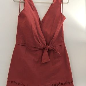 Adelyn Rae muted coral romper in size L